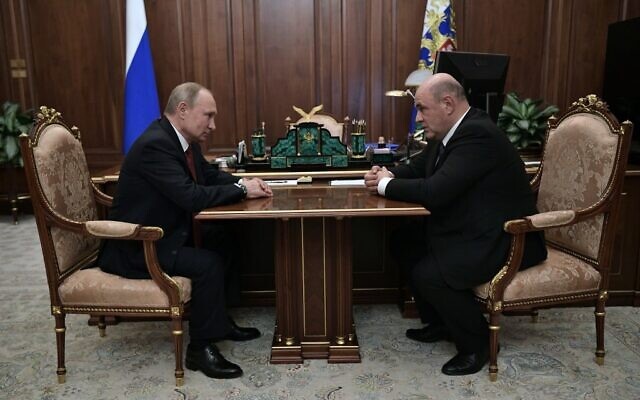 Tổng thống Nga Vladimir Putin và ông Mikhail Mishustin. Ảnh: AFP.
