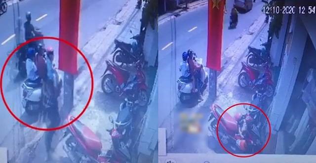 Người phụ nữ ra “tín hiệu” cho bé gái đi cùng trộm túi xách ở đường Huỳnh Văn Bánh, Phú Nhuận, TPHCM, sự việc xảy ra ngày 12.10.2020. Ảnh: Trích xuất từ camera an ninh