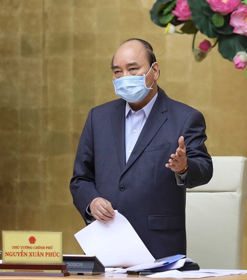 Thủ tướng Nguyễn Xuân Phúc chủ trì cuộc họp Thường trực Chính phủ chiều 27.3 - Ảnh: VGP/Quang Hiếu