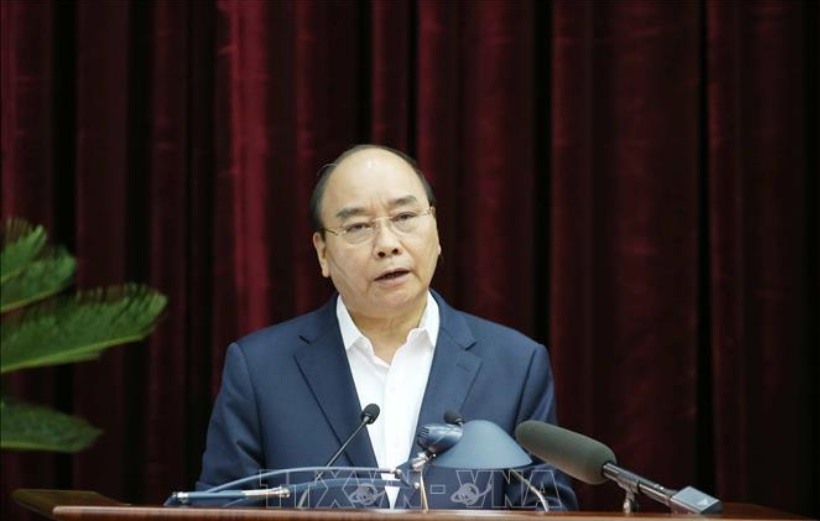 Thủ tướng Chính phủ Nguyễn Xuân Phúc trình bày báo cáo tại Hội nghị. Ảnh Phương Hoa/TTXVN