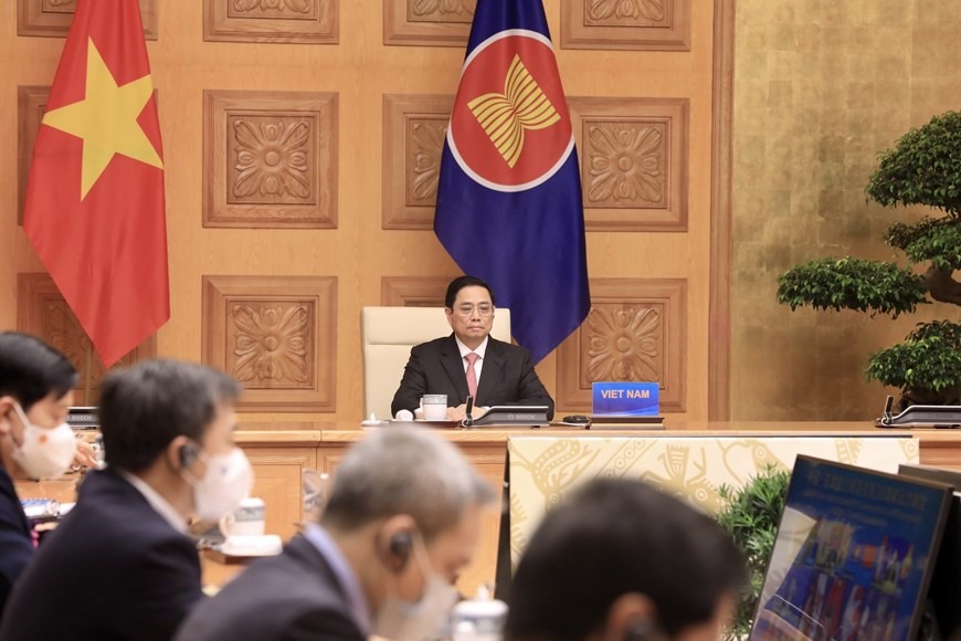 Thủ tướng Phạm Minh Chính dự Hội nghị cấp cao đặc biệt kỷ niệm 30 năm quan hệ ASEAN-Trung Quốc theo hình thức trực tuyến. Ảnh: TTXVN