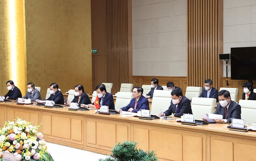Thủ tướng Phạm Minh Chính và các thành viên đoàn Việt Nam tham dự buổi hội kiến. Ảnh: TTXVN