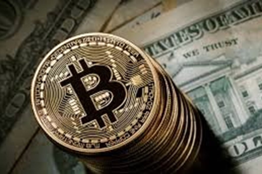 Giá bitcoin được dự báo có thể lên đến 1 triệu USD trong 10 năm tới. Ảnh: AFP