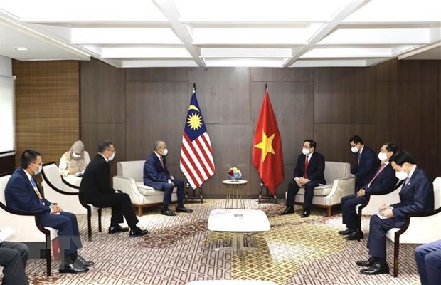 Thủ tướng Phạm Minh Chính hội kiến Thủ tướng Malaysia Muhyiddin Yassin. Ảnh: TTXVN