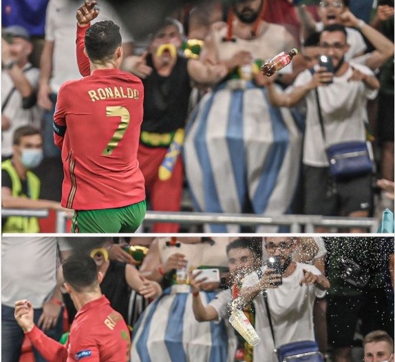 Ronaldo bị cổ động viên ném chai nước và Coca-Cola vào người, ở trận đấu với Pháp. Ảnh: Chụp màn hình.