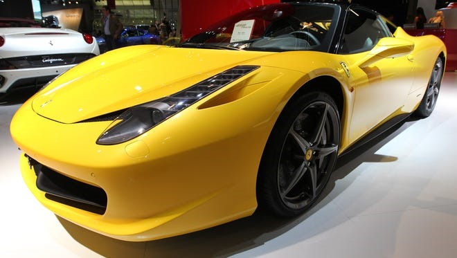 Usain Bolt cũng sở hữu 1 chiếc Ferrari 458 Italia vào năm 2010. Ảnh: AFP.