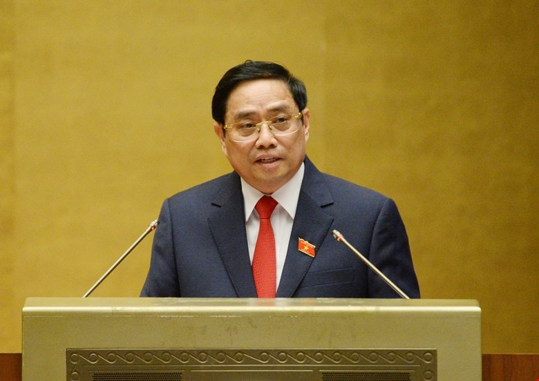 Thủ tướng Chính phủ Phạm Minh Chính trình bày tờ trình tại phiên họp. Ảnh QH