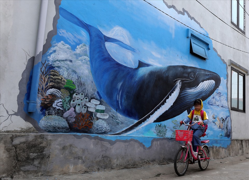 Cũng như bao làng biển khác của Việt Nam, làng Cảnh Dương cũng có tín ngưỡng thờ cá Ông (cá voi). Không chỉ có bức bích họa về cá Ông mà ở bìa làng, còn có nghĩa địa chôn cất 30 cá Ông lụy vào bờ biển của làng.