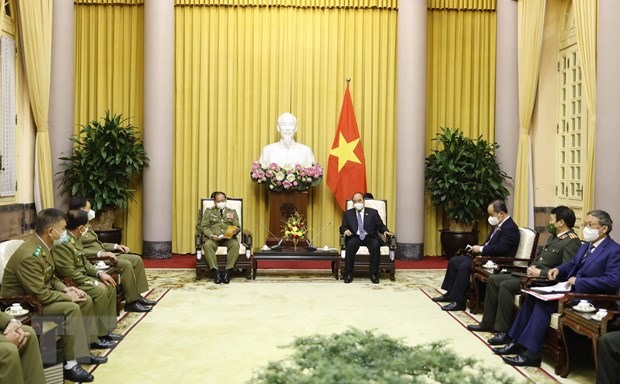 Chủ tịch nước Nguyễn Xuân Phúc tiếp Bộ trưởng Bộ Công an Lào Valay Lakhamphong. Ảnh: TTXVN