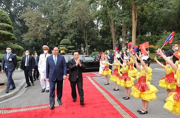Một vài hình ảnh trong lễ đón Thủ tướng Lào sáng 8.1. Ảnh: TTXVN