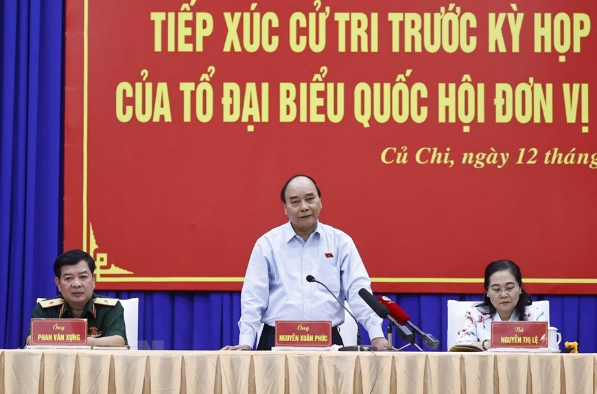 Chủ tịch nước Nguyễn Xuân Phúc phát biểu tại buổi tiếp xúc cử tri huyện Củ Chi.  Ảnh: TTXVN