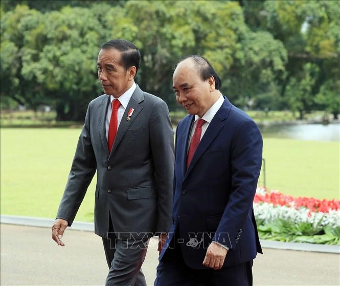 Chuyến thăm của Chủ tịch nước Nguyễn Xuân Phúc diễn ra theo lời mời của Tổng thống nước Cộng hòa Indonesia Joko Widodo. Ảnh: TTXVN
