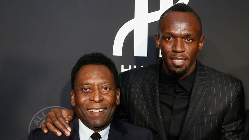 Ngôi sao điền kinh Usain Bolt và tấm hình chụp cùng Pele. Ảnh: Facebook Usain Bolt