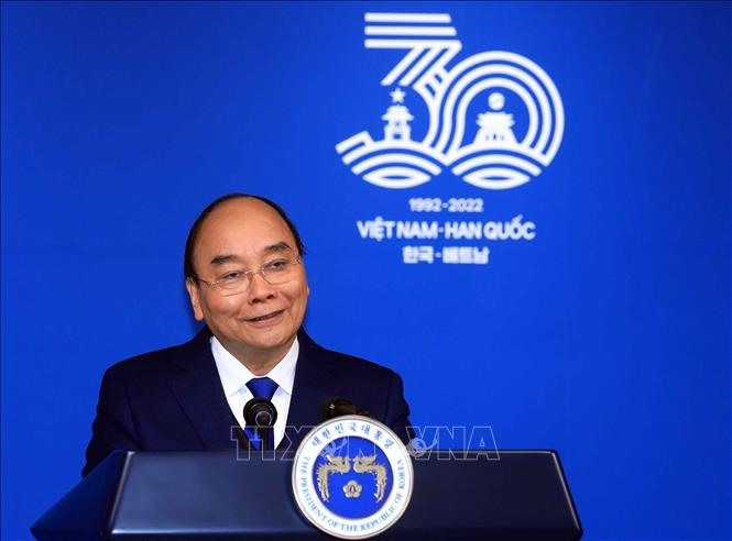 Chủ tịch nước Nguyễn Xuân Phúc phát biểu tại buổi họp báo chiều 5.12. Ảnh: TTXVN