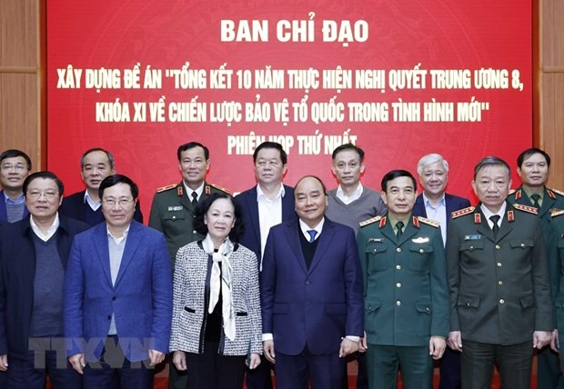Chủ tịch nước Nguyễn Xuân Phúc và các thành viên Ban Chỉ đạo. (Ảnh: Thống Nhất/TTXVN)