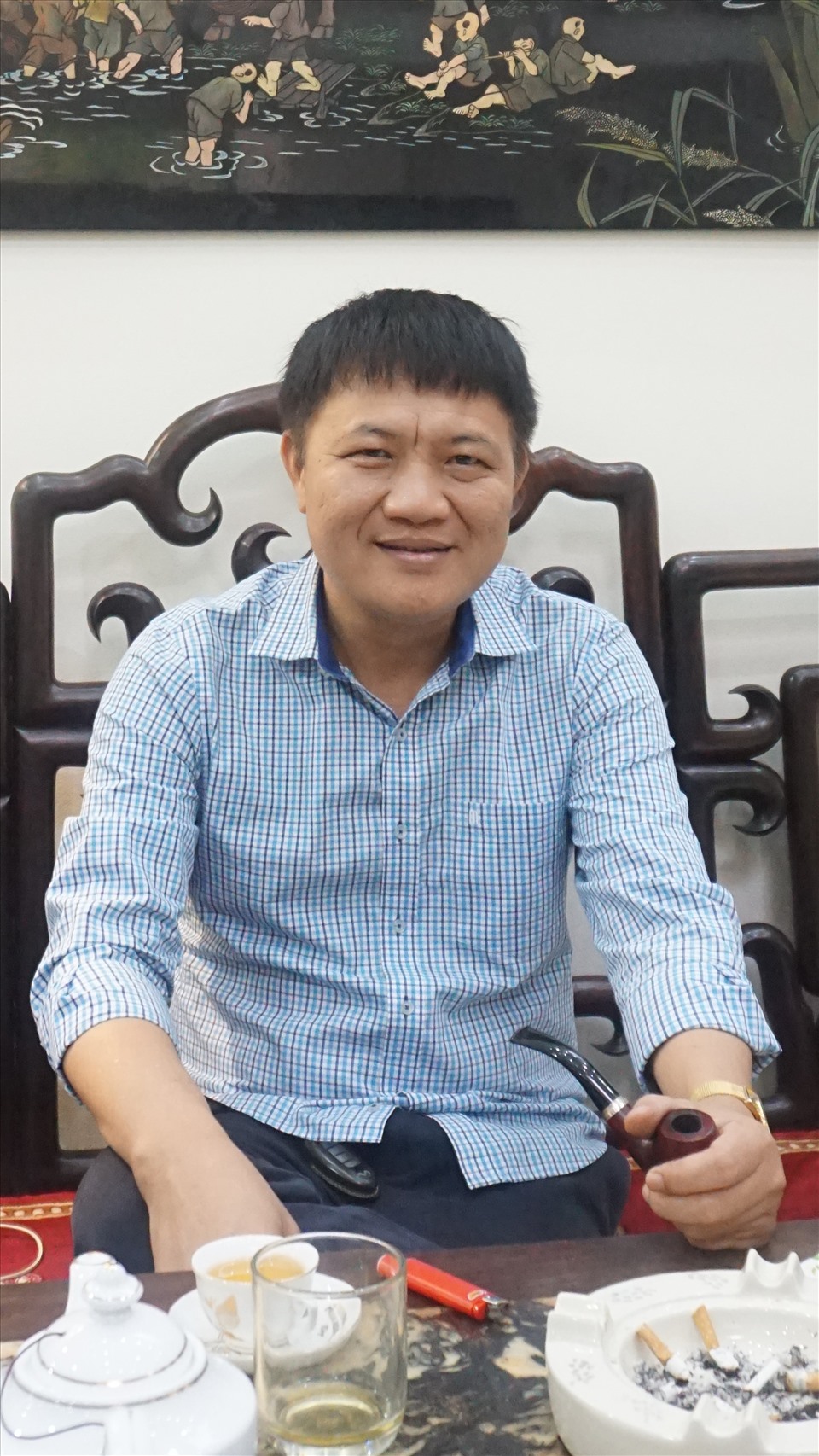 Nhà sưu tầm cổ vật Dương Minh Chính. Ảnh: Huy Minh