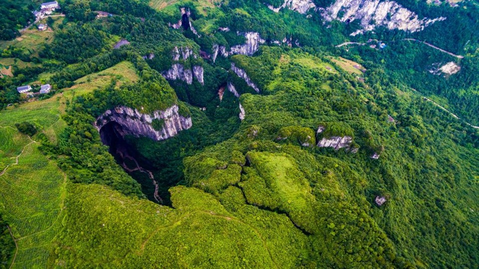 A giant sinkhole in China seen from above.  Screenshots