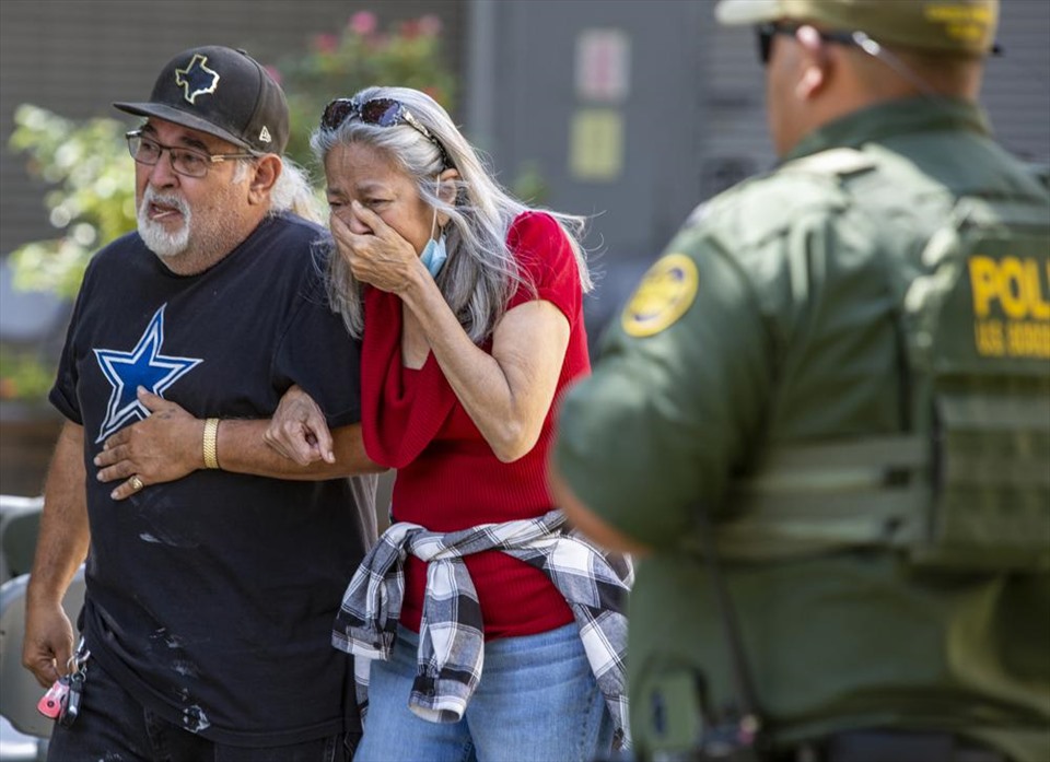 Relatives of the victims were shocked after the shooting.  Photo: AP