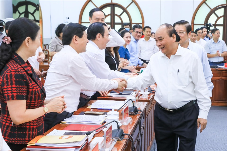 Chủ tịch nước Nguyễn Xuân Phúc với các đại biểu tại buổi làm việc với Đảng đoàn MTTQ Việt Nam về xây dựng Nhà nước pháp quyền. Ảnh: Phạm Đông
