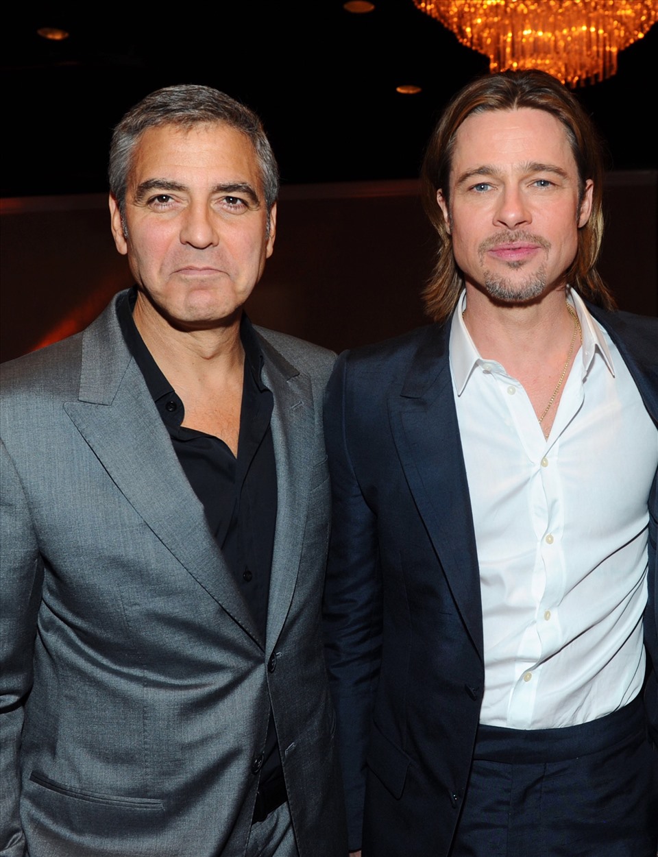 Brad Pitt và người bận thân lâu năm George Clooney. ẢNh: Xinhua