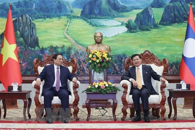 Thủ tướng Phạm Minh Chính hội kiến Tổng Bí thư, Chủ tịch nước Lào Thongloun Sisoulith. Ảnh: TTXVN