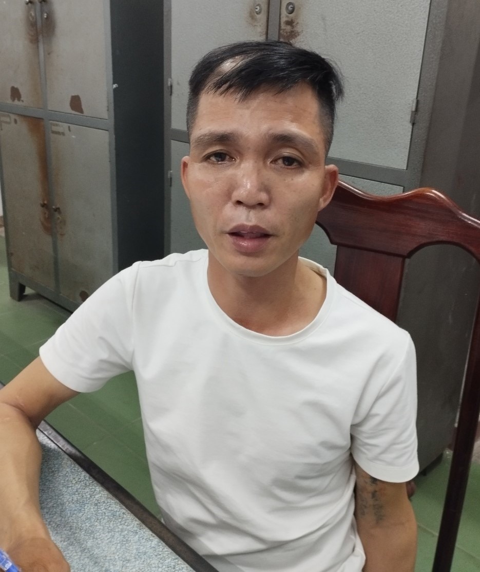 Đối tượng Phạm Quang Trang tại Cơ quan điều tra. Ảnh: Công an cung cấp