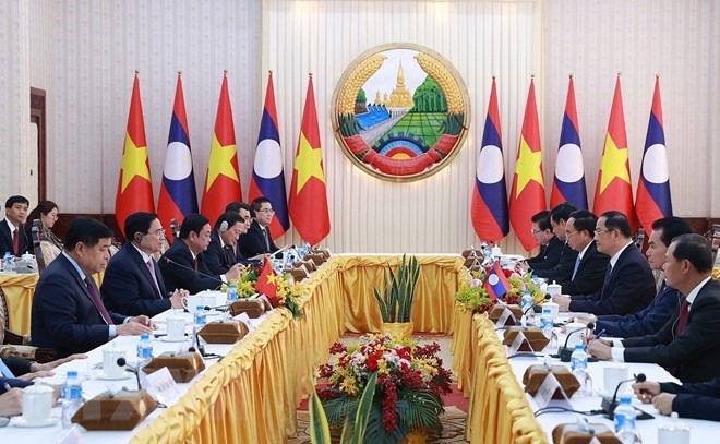 Việt Nam - Lào nhất trí tiếp tục nâng tầm hợp tác kinh tế. Ảnh: TTXVN