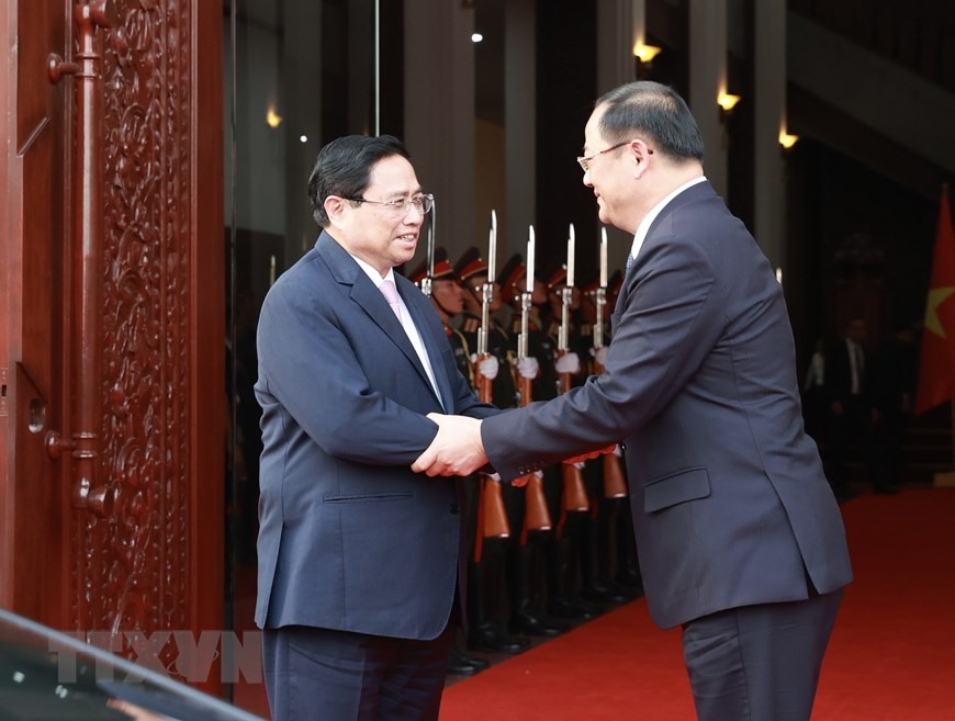 Thủ tướng Phạm Minh Chính chúc mừng Lào tổ chức thành công Hội nghị Ủy hội sông Mekong quốc tế lần thứ 4. Ảnh: TTXVN