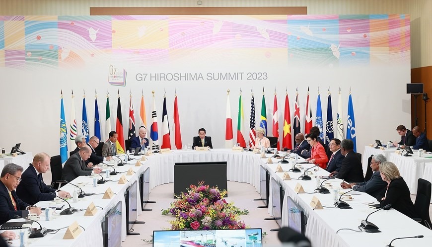 Thủ tướng Phạm Minh Chính và trưởng đoàn Nhóm các nước công nghiệp phát triển (G7) mở rộng tham dự phiên thảo luận đối tác về cơ sở hạ tầng và đầu tư toàn cầu. Ảnh: TTXVN