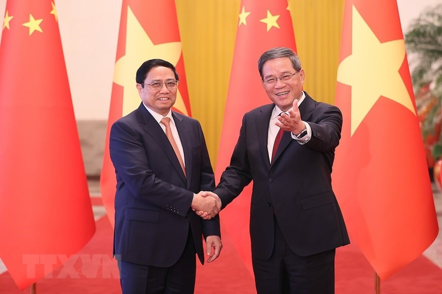 Thủ tướng Trung Quốc Lý Cường đón Thủ tướng Chính phủ Phạm Minh Chính. Ảnh: TTXVN