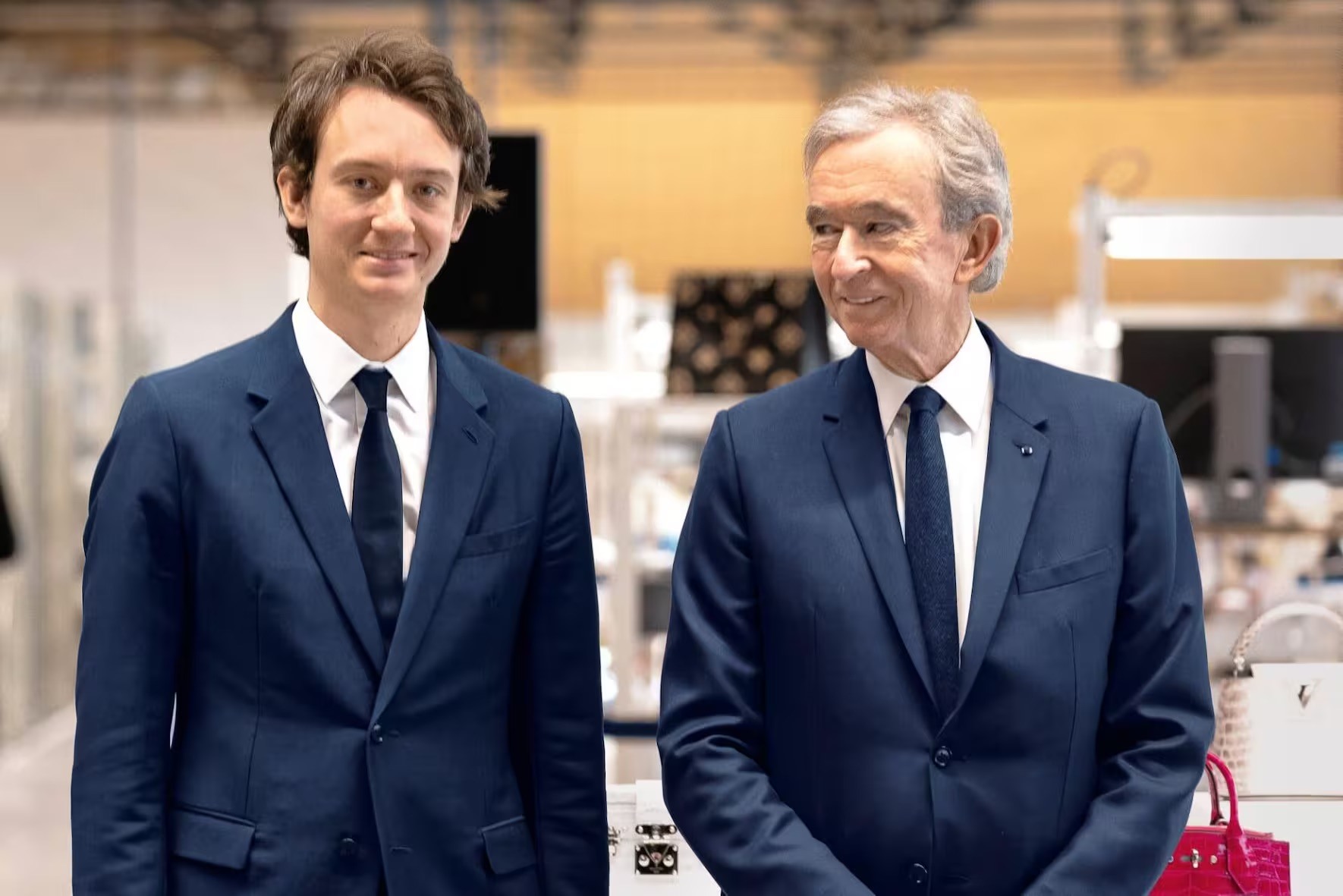 Frédéric và tỉ phú Bernard Arnault. Ảnh: SCMP