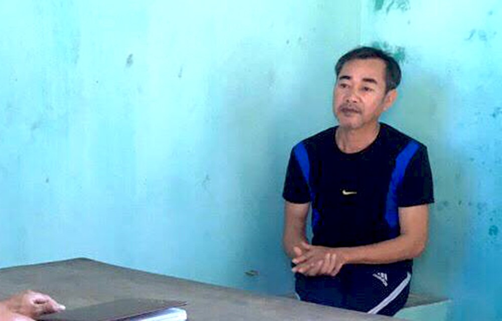 Đối tượng Nguyễn Quang Chung tại cơ quan điều tra. Ảnh: T.B