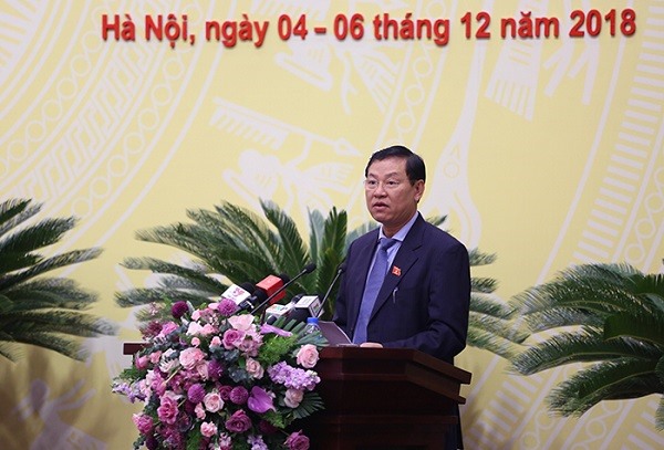 Chánh án TAND TP Hà Nội Nguyễn Hữu Chính báo cáo công tác xét xử trên địa bàn.