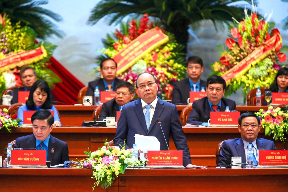 Đồng chí Nguyễn Xuân Phúc - Uỷ viên Bộ Chính trị, Thủ tướng Chính phủ (giữa) tại diễn đàn. Ảnh: Hải Nguyễn.