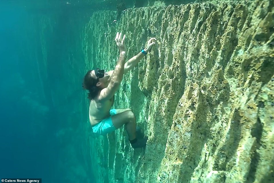 Chuyên gia người Úc Adam Stern, 28 tuổi, người đã vượt qua nỗi sợ độ cao của mình bằng cách leo lên một vách đá dưới nước ở hồ Barracuda ở Philippines. Ông được xếp hạng cao trên thế giới và nắm giữ nhiều kỷ lục của Úc