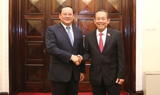 Phó Thủ tướng Thường trực Chính phủ Trương Hòa Bình và Phó Thủ tướng Lào Sonexay Siphandone. Ảnh: VGP

