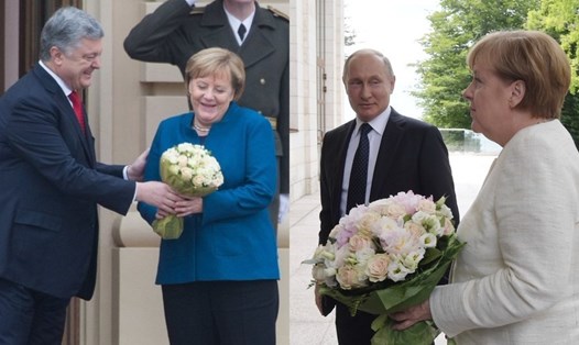 Tổng thống Ukraina Petro Poroshenko (trái) tặng Thủ tướng Đức Angela Merkel bó hoa giống hệt của Tổng thống Nga Vladimir Putin. Ảnh: Sputnik