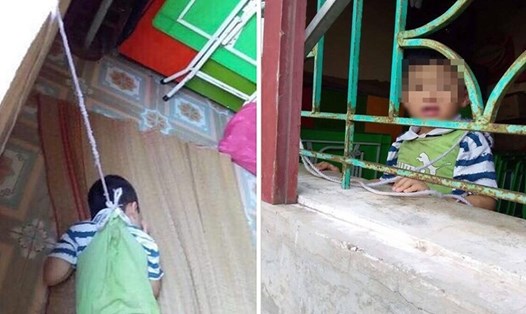 Hình ảnh bé trai 4 tuổi bị treo lên cửa sổ đang gây bão dư luận.