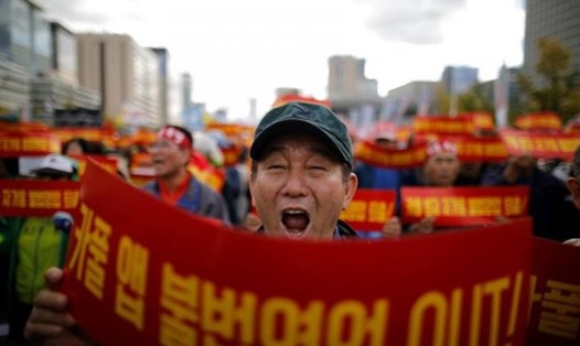 Giới tài xế taxi Hàn Quốc phản đối dịch vụ đi chung xe. Ảnh: Reuters
