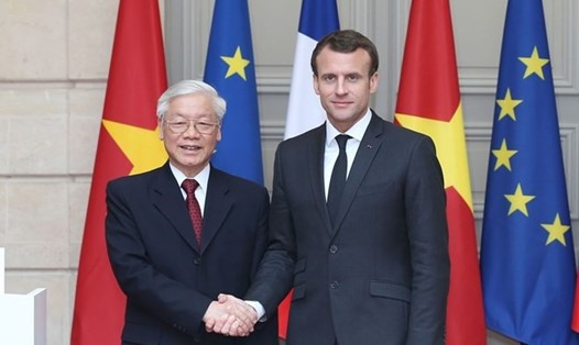Tổng Bí thư Nguyễn Phú Trọng và Tổng thống Cộng hòa Pháp Emmanuel Macron. Ảnh: TTXVN.