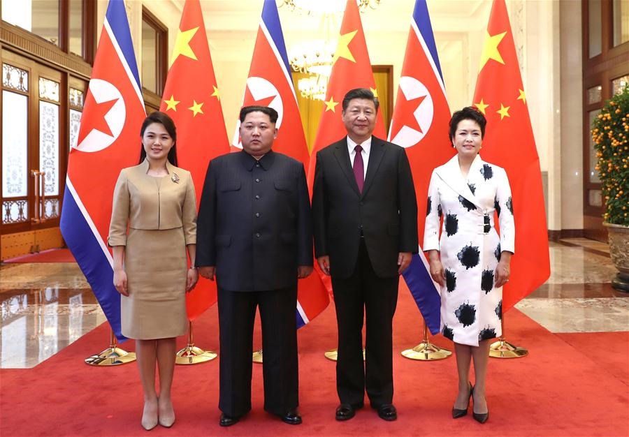Chủ tịch Tập Cận Bình và Phu nhân Bành Lệ Viện đón tiếp nhà lãnh đạo Kim Jong-un và Phu nhân Ri Sol Ju. Ảnh: Tân Hoa xã