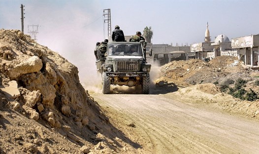 Quân chính phủ Syria chiếm thị trấn Beit Sawa và Misraba ở Đông Ghouta. Ảnh: SANA/EPA