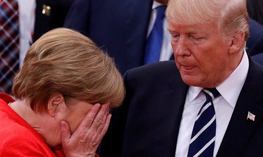 Tổng thống Donald Trump dò hỏi Thủ tướng Angela Merkel về cách cư xử với Tổng thống Vladimir Putin. Ảnh: Reuters