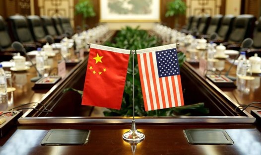 Trung Quốc tuyên bố để ngỏ đàm phán thương mại với Mỹ, với điều kiện bỏ "dao kề cổ". Ảnh: Reuters