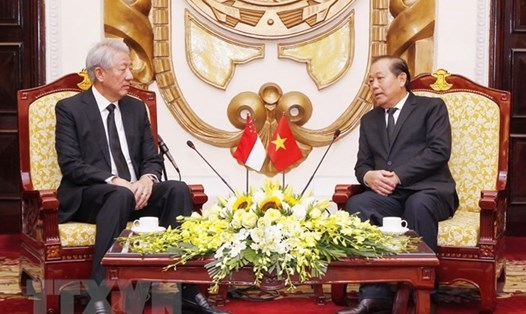 Phó Thủ tướng Thường trực Trương Hòa Bình tiếp Phó Thủ tướng Singapore Tiêu Chí Hiền. Ảnh: TTXVN. 