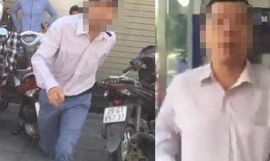 Người đàn ông đánh phụ nữ khi bị nhắc xếp hàng ở cây ATM quận Thanh Xuân. Ảnh cắt từ clip