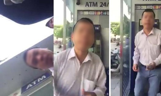 Người đàn ông đánh phụ nữ tại cây ATM. Ảnh cắt từ clip