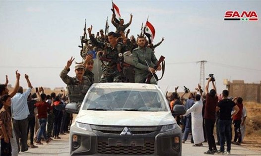 Quân đội Syria tiến vào thành phố phía bắc Tal Tamr sau khi đạt thoả thuận với người Kurd để triển khai quân trong khu vực. Ảnh: SANA