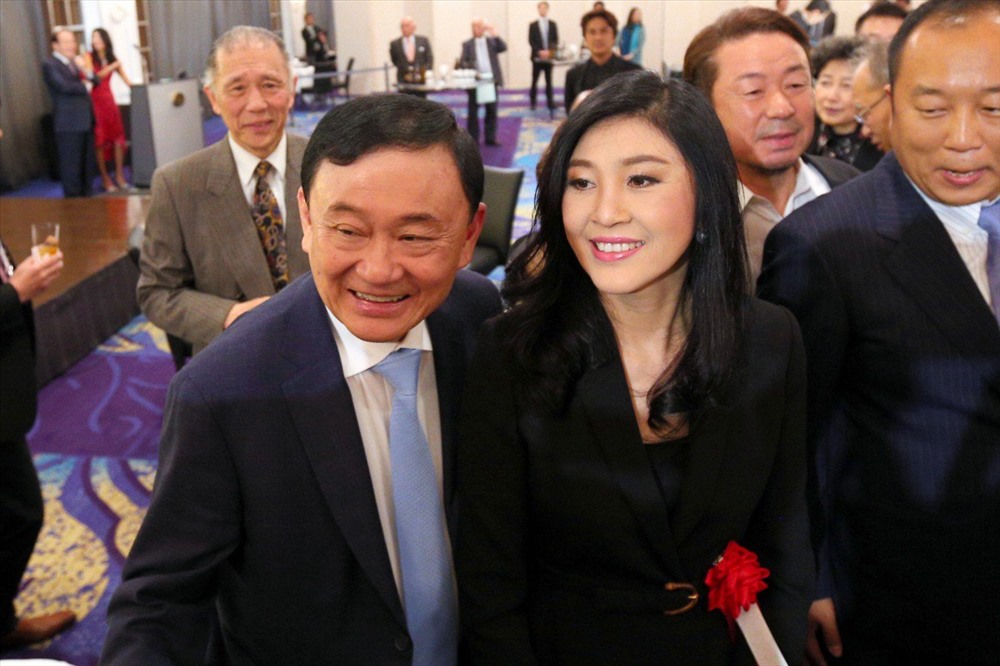 Ông Thaksin và bà Yingluck Shinawatra tại Tokyo hồi tháng 3 năm ngoái. Ảnh: SCMP. 