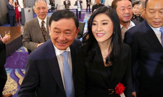 Ông Thaksin và bà Yingluck Shinawatra tại Tokyo hồi tháng 3 năm ngoái. Ảnh: SCMP. 